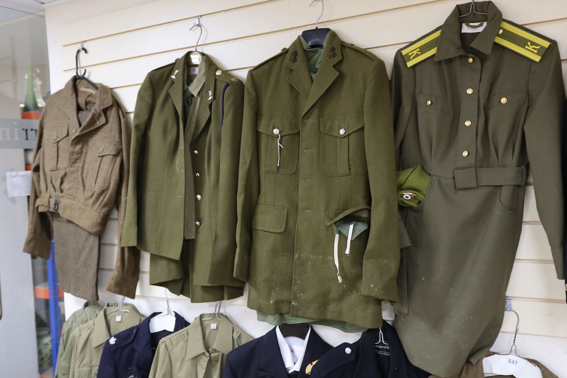 A collection of mixed Royal Navy and army military uniforms, including Royal Australian Corps of Signals (woman’s), Royal Artillery, Russian Army etc.